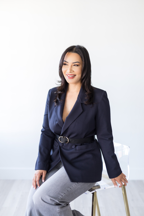 Keline Baez, NP-C seated at The Beauty Lab