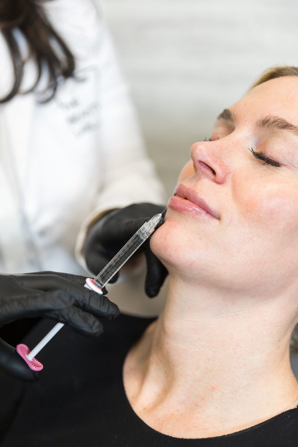 A client receiving a facial injectable treatment
